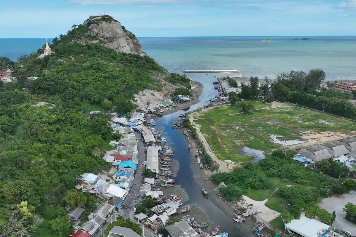 Khao Takiab hill with hilltop temple and fishing boats in Hua Hin