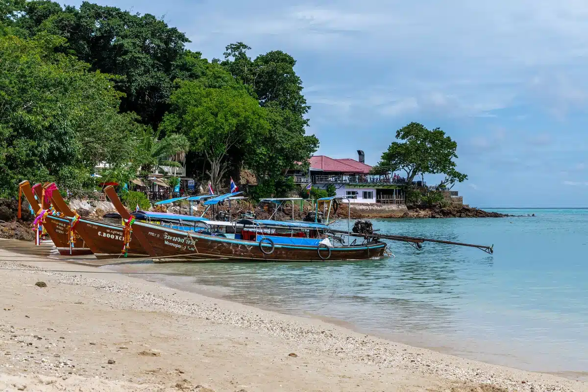 Longtail boats on a quiet beach near Kamala, Phuket